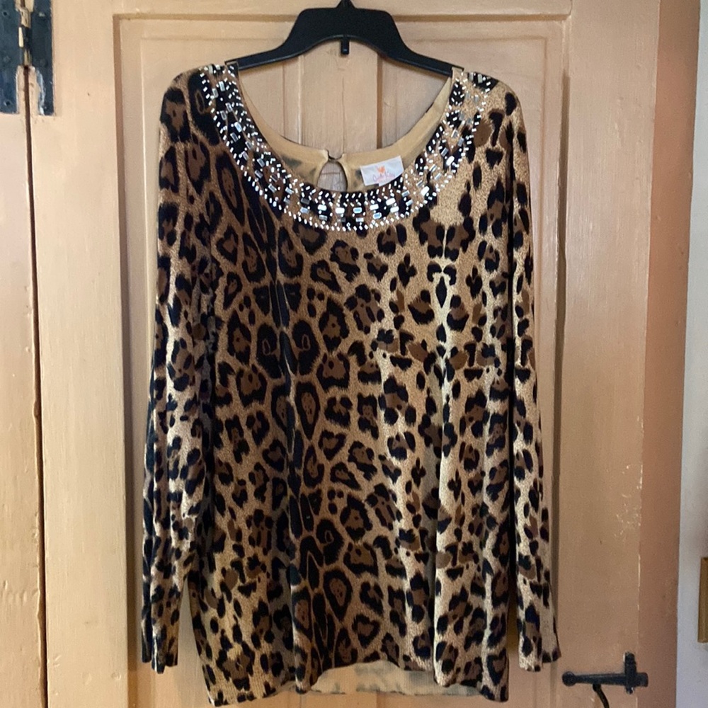 Women’s long sleeve embellished top.